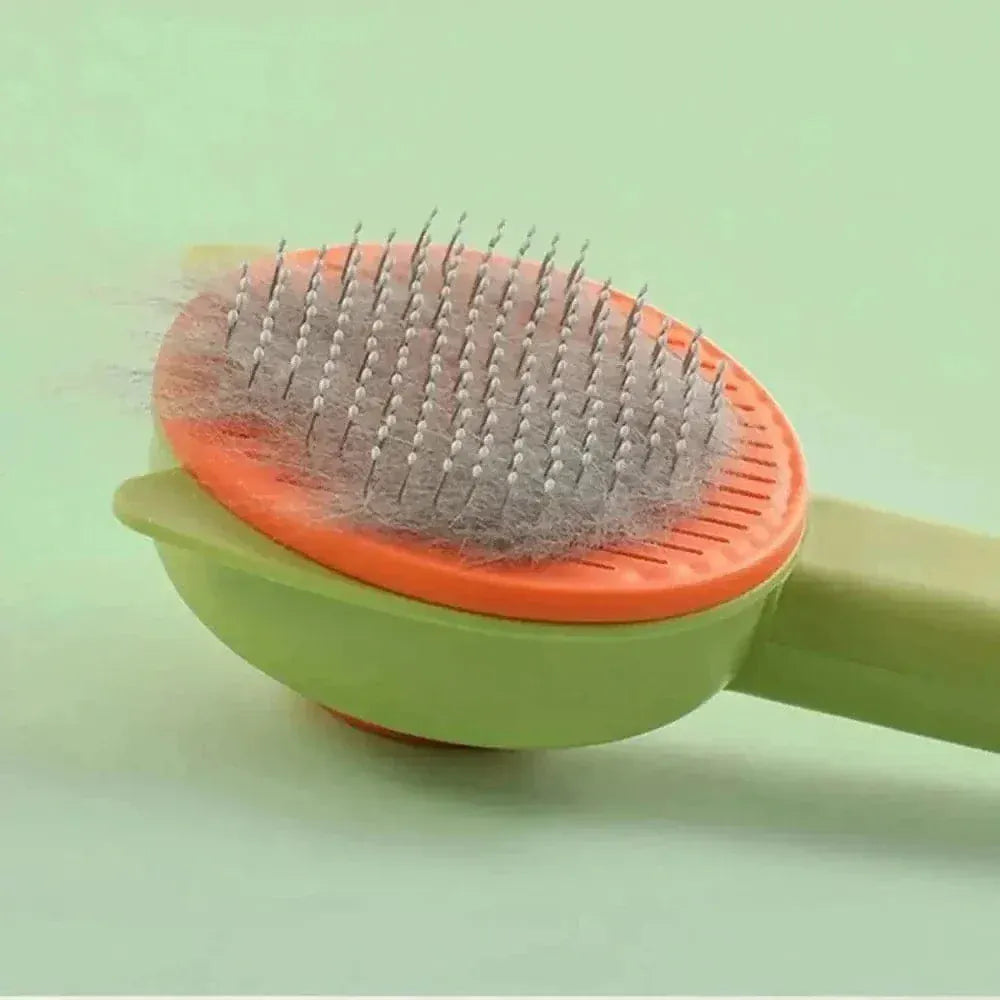 Self-cleaning cat brush